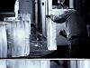 A man cutting ice blocks