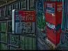 A battery vending machine and an old Coke sign